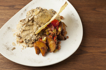 pork in mushroom sauce with baked potato
