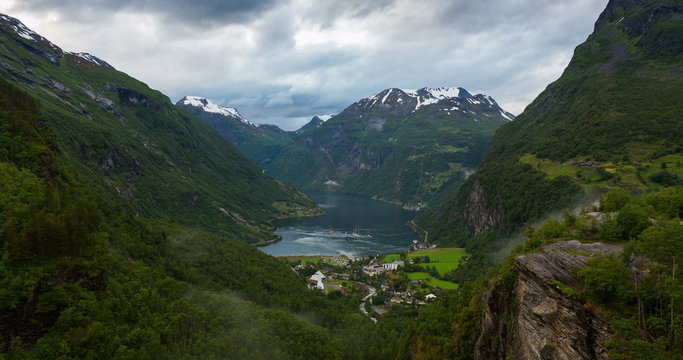 4K, Norway Mountains And Fjord View - Occurrence of fog, Clouds Time Lapse, Geirangerfjord, Stranda, Norway - Tilt UP