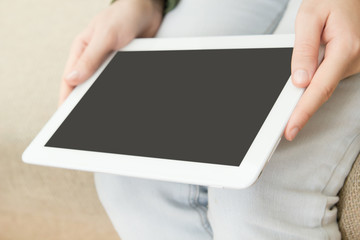 Woman using digital tablet detail