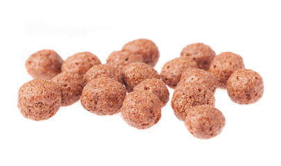 chocolate cereal balls isolated on white background