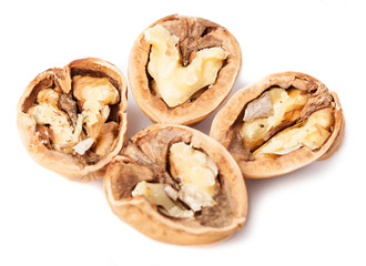 some walnuts opened on a white background
