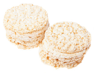 two piles of puffed rice snack on a white background