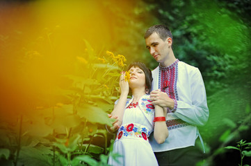 Fototapeta premium Happy young couple in national dress