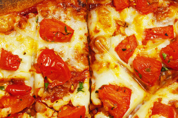 Pizza with tomatoes and cheese  top view