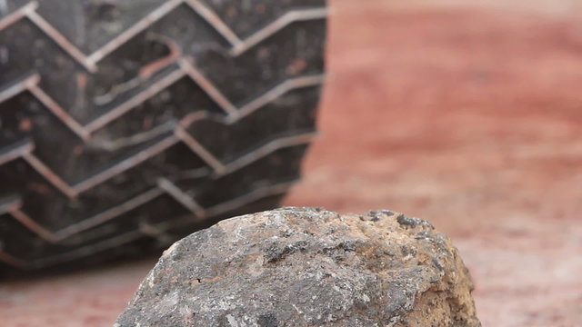Close up of a Mars space rover's wheels.  Similar type as currently on Curiosity rover with red simulated Martian regolith.