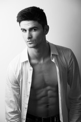 Handsome guy looking at camera, studio portrait