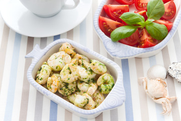 Serving with shrimp and herbs