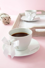 Coffee cups with ribbon on the handle