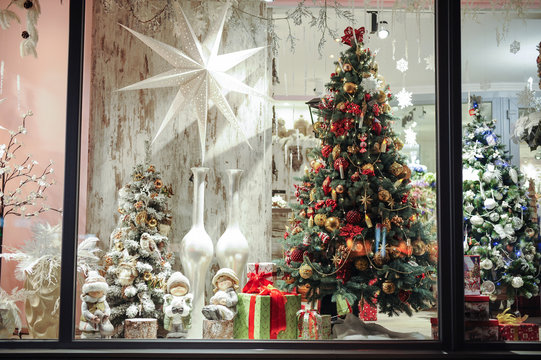Gift boxes , sweets and christmas decor in shop window
