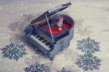 Music box with little ballerina on christmas background