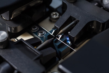 Working with fiber optic fusion splicer before connecting. Selec