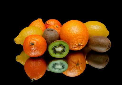 fresh juicy fruits on a black background