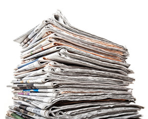 stack of daily newspapers
