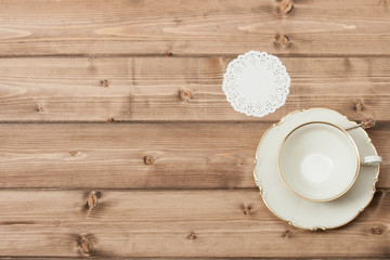 Cup And Plate. Wooden Background With Copy Space