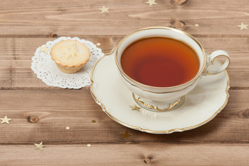 Cup Of Tea. Mince Pie. Shining Stars. Wooden Background With Cop