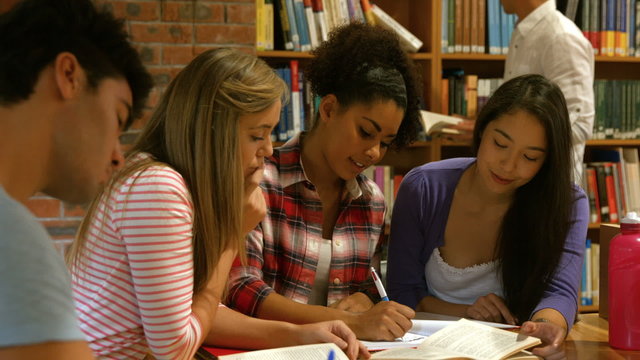 Students revising together in the library