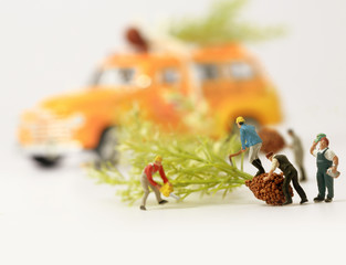 Workers(miniature) preparing Christmas presents.Selective focus