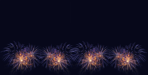 Fototapeta premium Fireworks background. Colorful fireworks in the night sky.