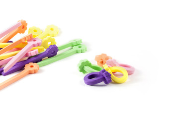 few color hair curlers on a white background