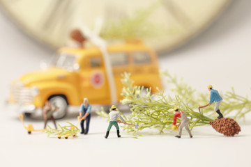 Workers(miniature) preparing Christmas presents.Selective focus