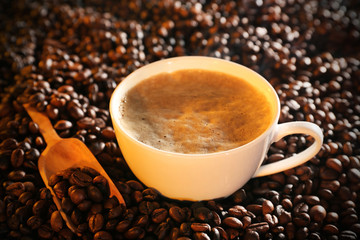 Cup of coffee and coffee beans closeup
