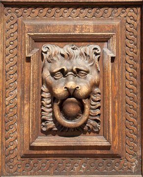 fragment of woodcarving at the door in Prague