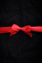 Red ribbon over black