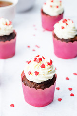 cupcake with cream cheese frosting and heart sprinkles for Valen