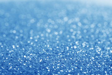 Blue defocused glitter background.