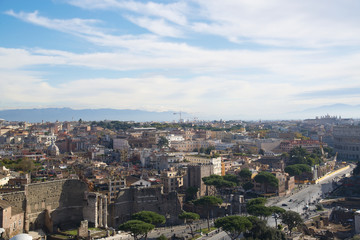 Fototapeta na wymiar The view from the roof of the building to the streets of Rome, Italy.