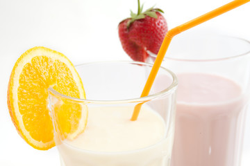 yoghurt drink in a glass beaker on a white background