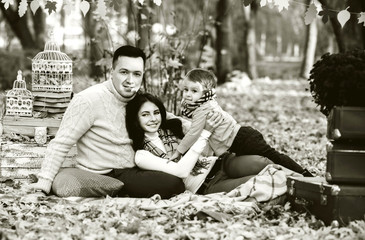 Happy family in the park, autumn time