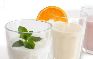 yoghurt drink in a glass beaker on a white background