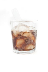 Cola with ice and lemon in a glass beaker