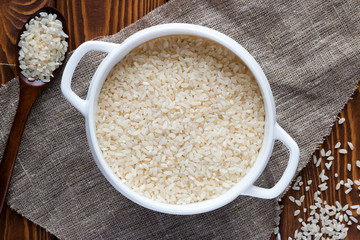 dish with rice and wooden spoon on a napkin