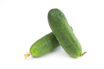 A fresh green cucumber isolated on a white background