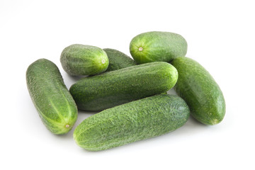 A fresh green cucumber isolated on a white background