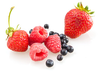 Beautiful raspberry, strawberries and blueberries isolated on wh