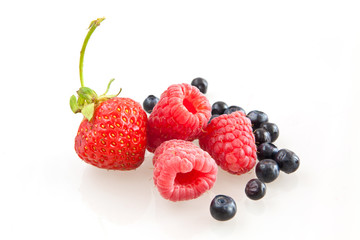 Beautiful raspberry, strawberries and blueberries isolated on wh