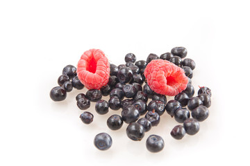 Beautiful raspberry and blueberries isolated on white