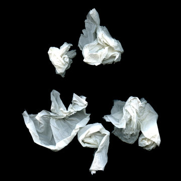 Crumpled paper ball isolated on a black background