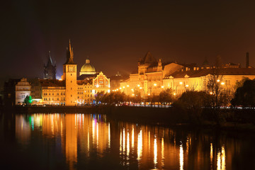 Obraz na płótnie Canvas The night View on bright Prague Old Town above the River Vltava, Czech Republic