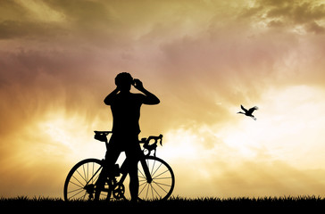 cyclist photographing the sunset
