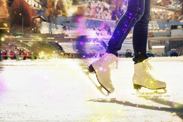 Obraz na płótnie Canvas Closeup skating shoes ice skating outdoor at ice rink