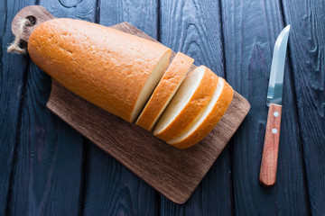 sliced loaf on a black background