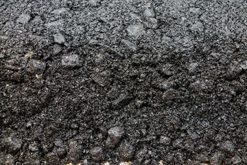 Close-up asphalt at the road under construction.