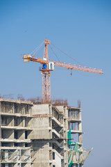 Construction site and crane at a highrise building