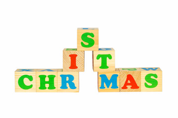 Wood cube with inscription CHRISTMAS 