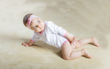 Cute baby crawling on the carpet