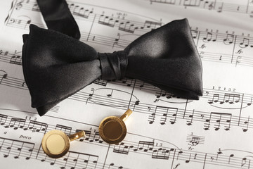 Formal Black Bow Tie and Cuff Links on Sheet Music